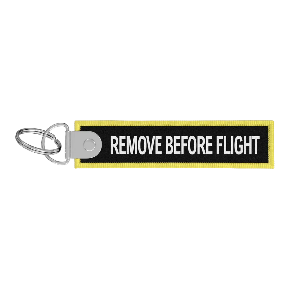 Porte-clés flamme Remove Before Flight noire / CDG
