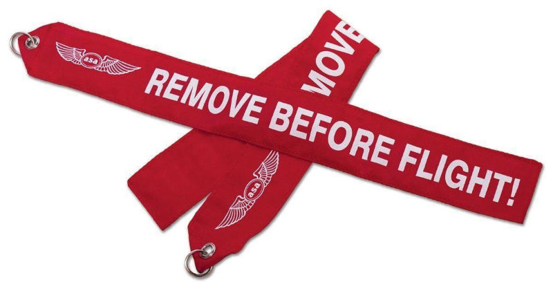 flamme remove before flight rouge et texte blanc