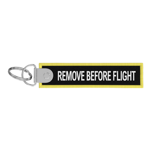 Porte-clés flamme Remove Before Flight noire / CDG